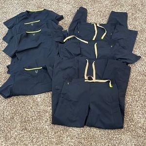 Set of 4 Black Medelita scrubs. Small Top Large Bottom.